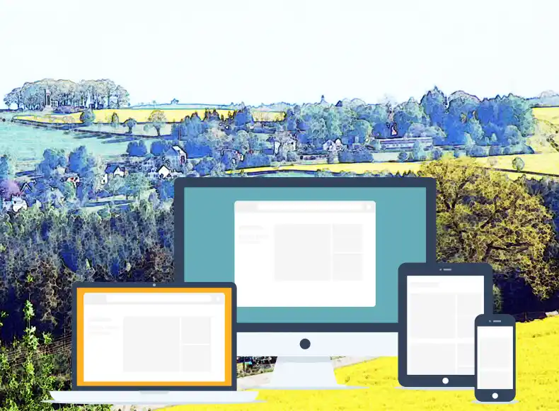 PC, Laptop, Tablet vor Landschaft im Vogtland